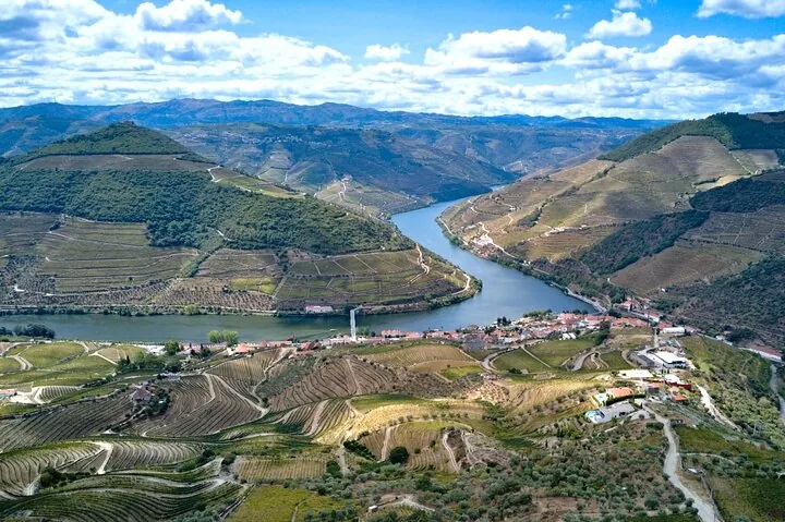 Aerial view of the Douro River and surrounding terraced vineyards